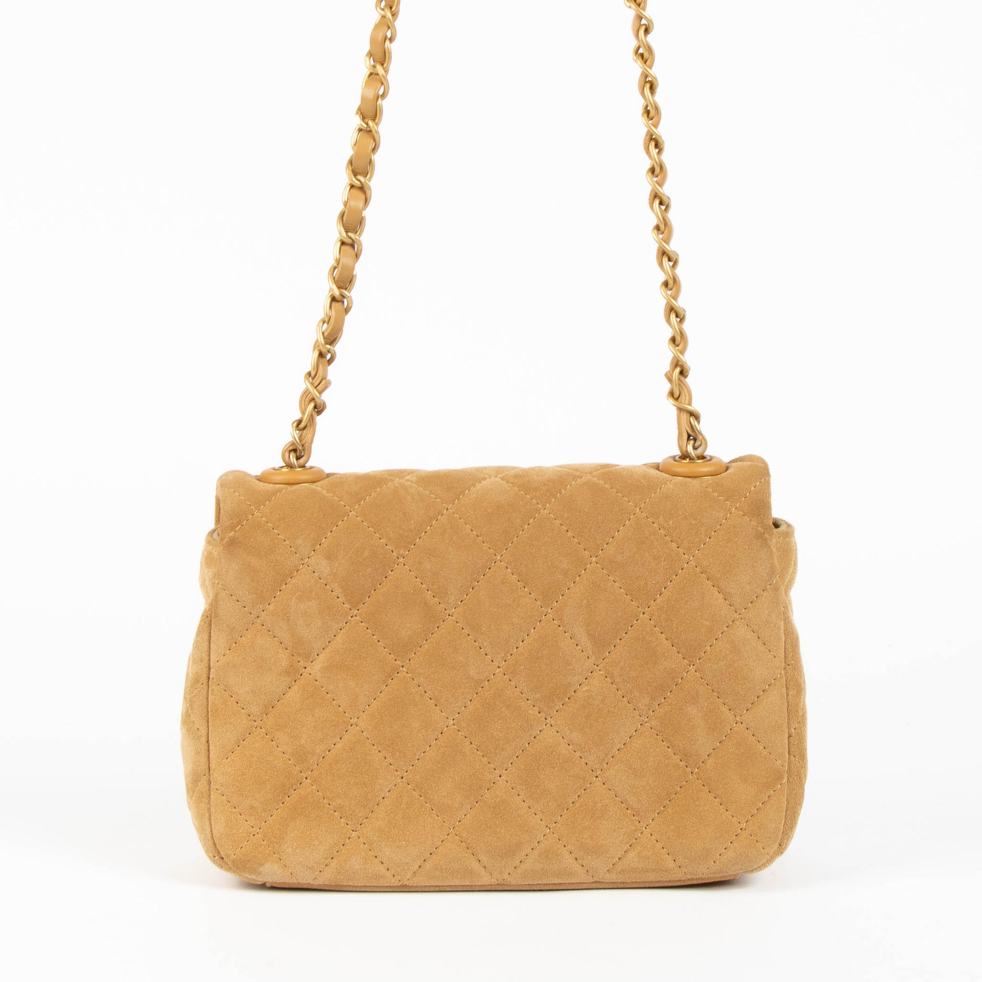 Shop this 100% authentic Chanel Beige Suede Mini Flap Bag at Labellov.com