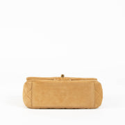 Shop this 100% authentic Chanel Beige Suede Mini Flap Bag at Labellov.com