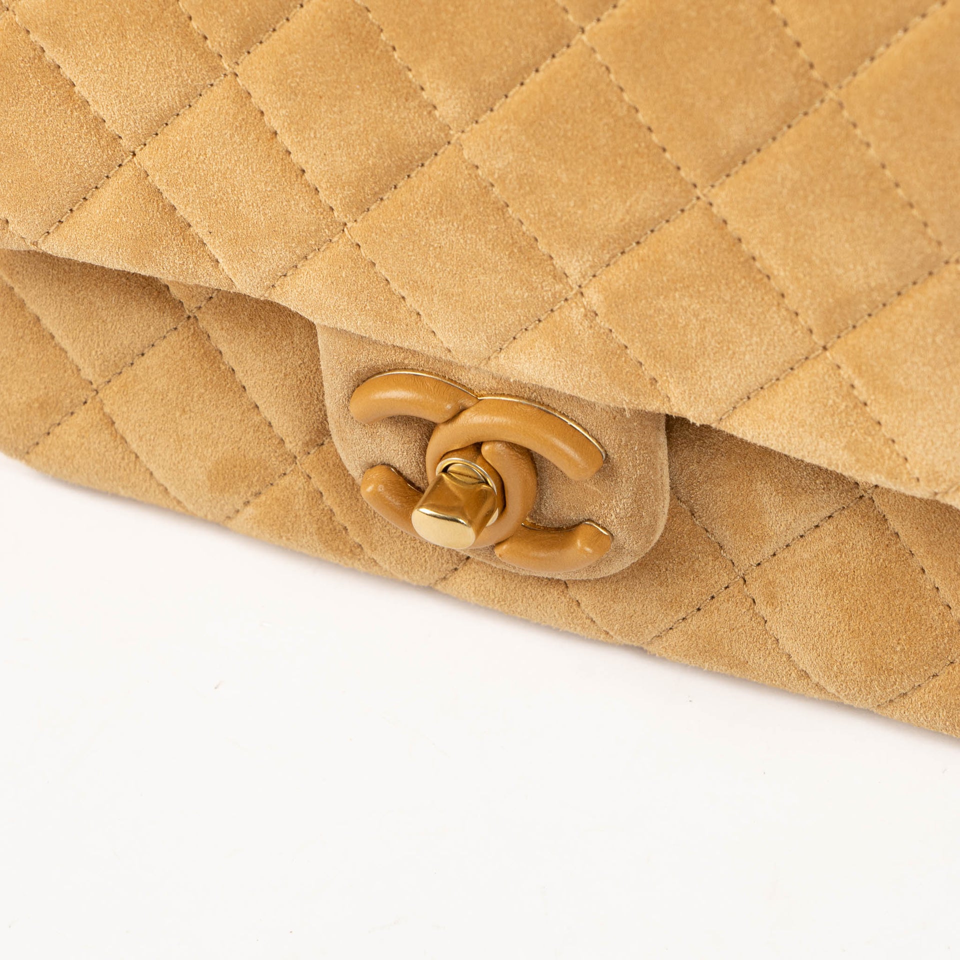 Shop this 100% authentic Chanel Beige Suede Mini Flap Bag at Labellov.com