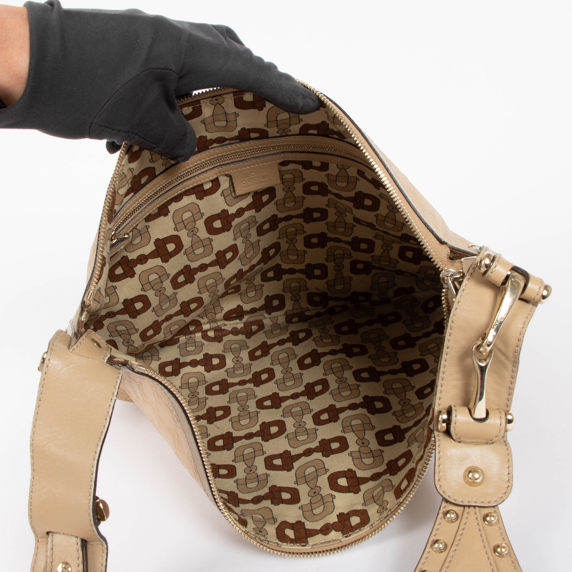 Shop this authentic Gucci Beige Guccissima Pelham Medium Hobo pre-loved on Labellov.com