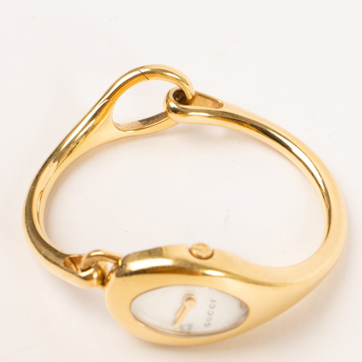 Shop this authentic Gucci Gold-Tone Oval Bangle Watch pre-loved on Labellov.com