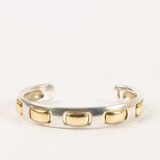 Shop this authentic Hermes Vintage Sterling Silver/Gold Bangle Bracelet Pre-Loved on Labellov.com