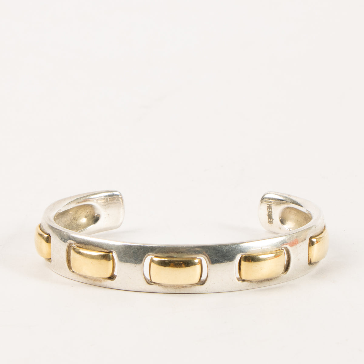 Shop this authentic Hermes Vintage Sterling Silver/Gold Bangle Bracelet Pre-Loved on Labellov.com