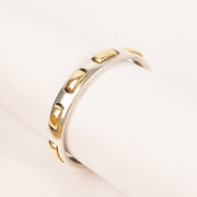Shop this authentic Hermes Vintage Sterling Silver/Gold Bangle Bracelet Pre-Loved on Labellov.com