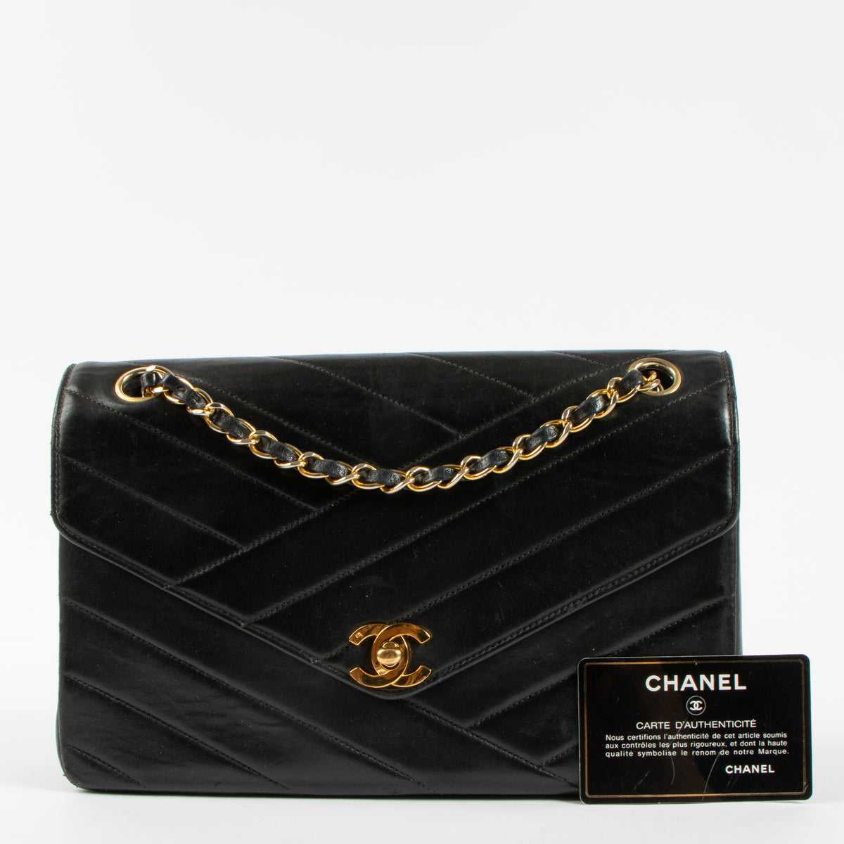 Shop the Chanel Vintage Black Lambskin Flap Bag in good condition at Labellov. A timeless vintage Chanel classic with iconic design.

