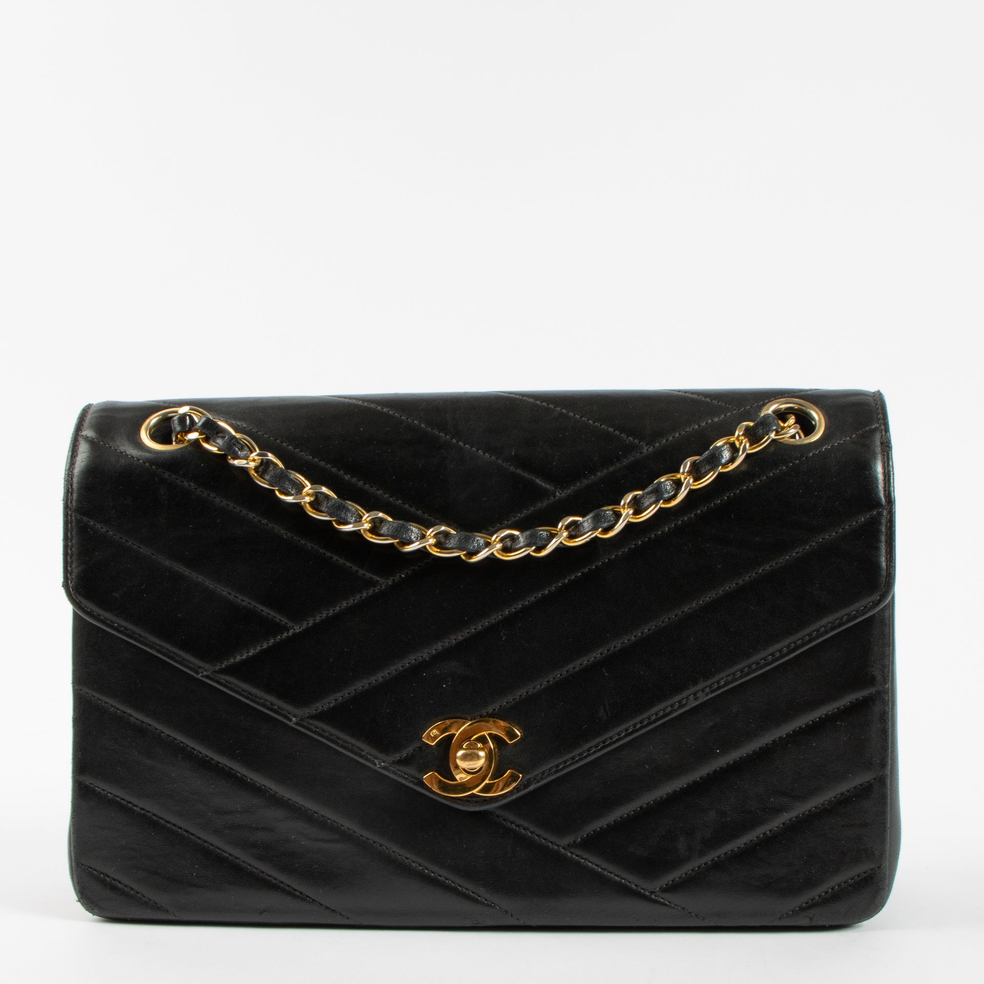 Shop the Chanel Vintage Black Lambskin Flap Bag in good condition at Labellov. A timeless vintage Chanel classic with iconic design.
