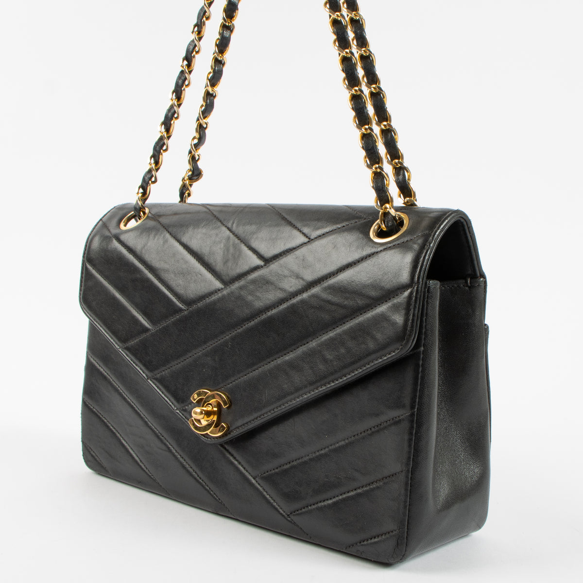 Shop the Chanel Vintage Black Lambskin Flap Bag in good condition at Labellov. A timeless vintage Chanel classic with iconic design.
