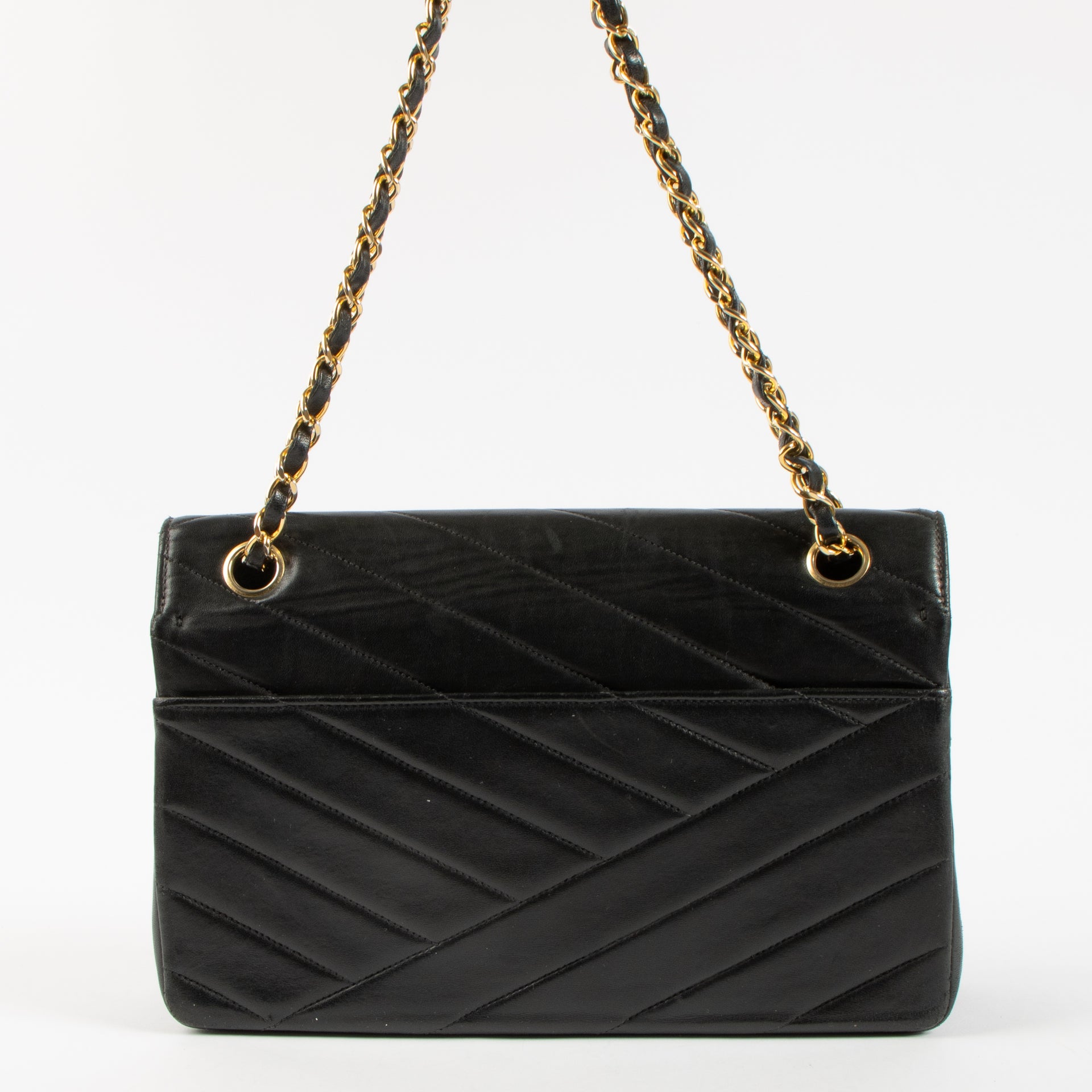 Shop the Chanel Vintage Black Lambskin Flap Bag in good condition at Labellov. A timeless vintage Chanel classic with iconic design.
