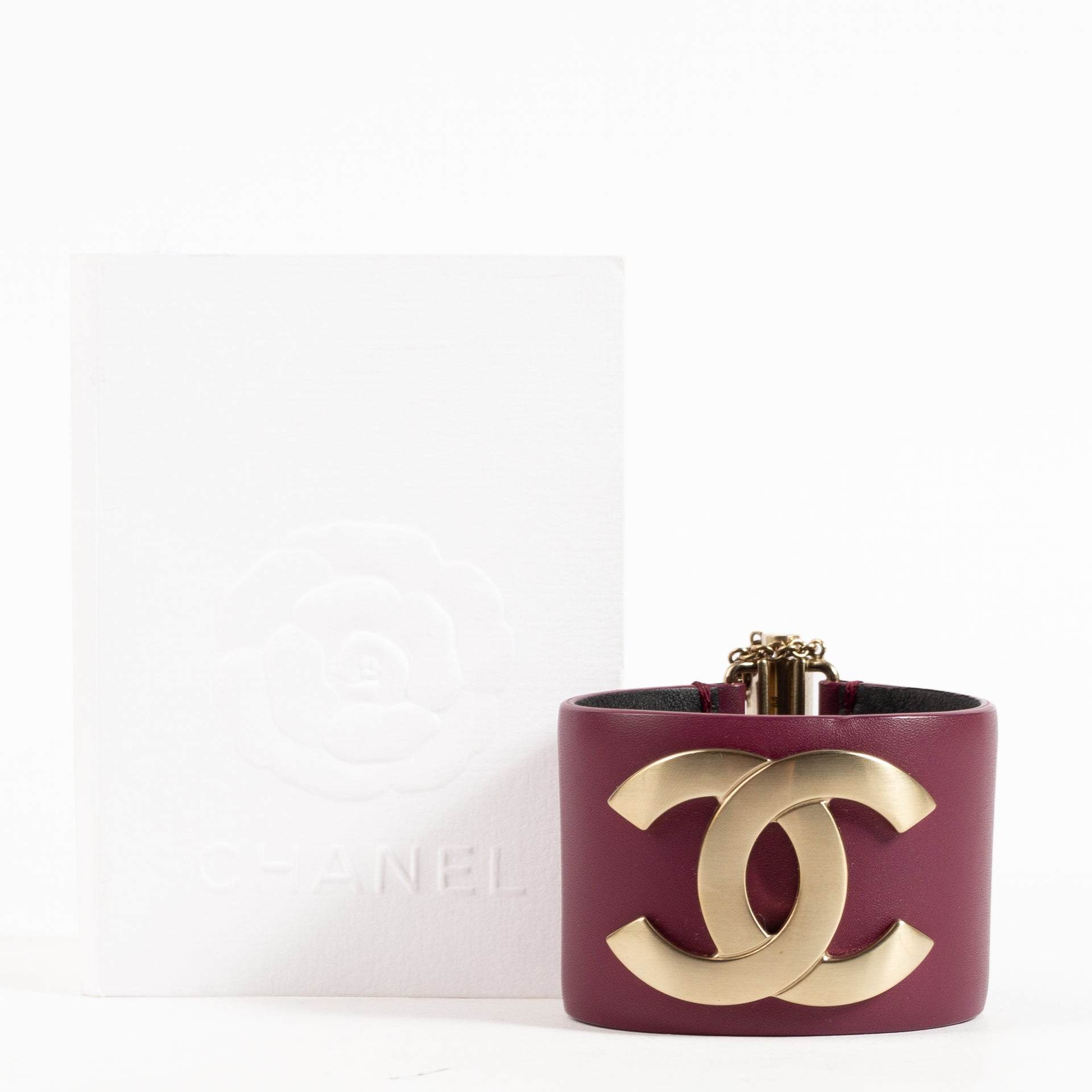 Shop the authentic Chanel 18C Burgundy Leather CC Cuff Bracelet on Labellov.com !