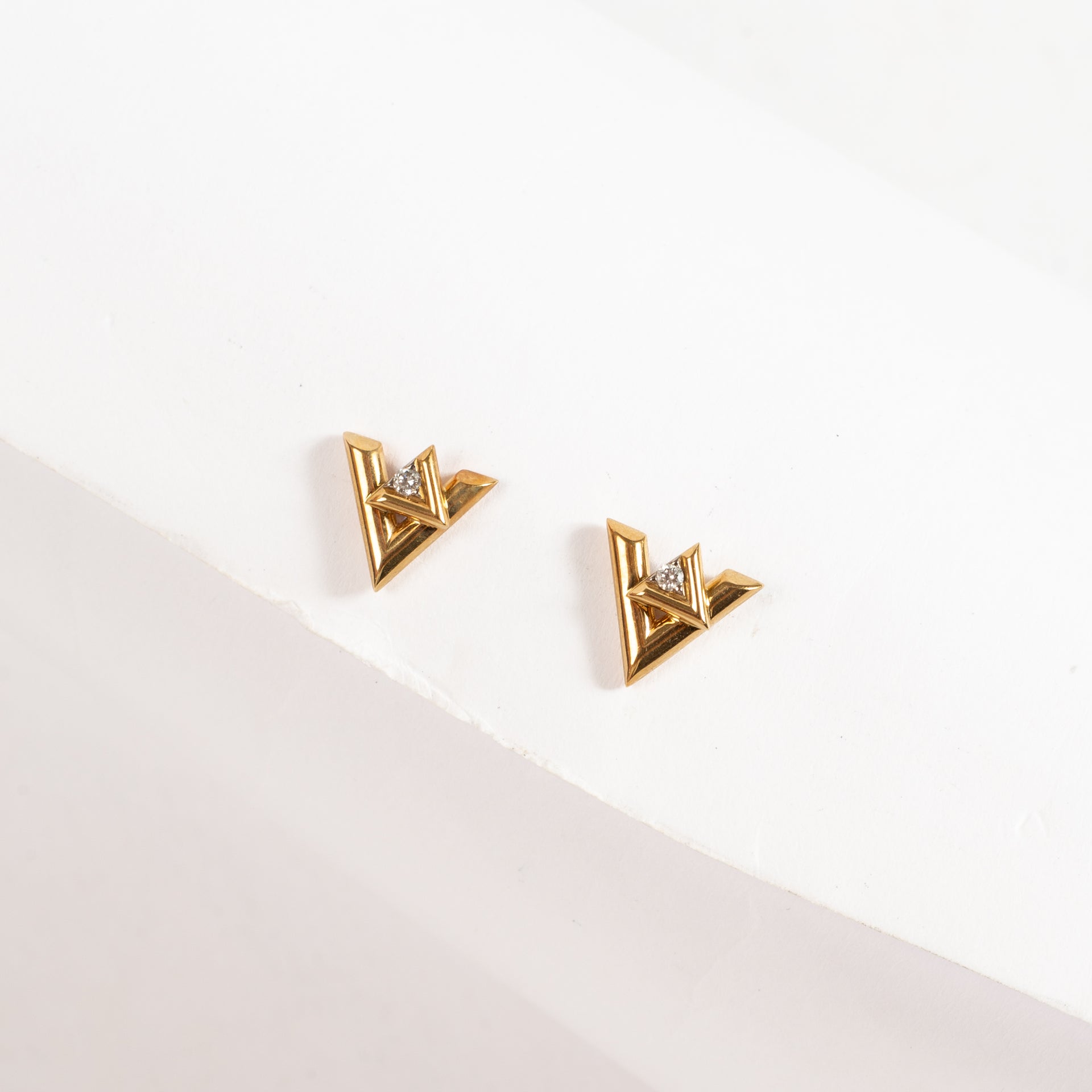 Shop the authentic Louis Vuitton Set of 2 Gold LV Volt Stud Earrings on Labellov.com !