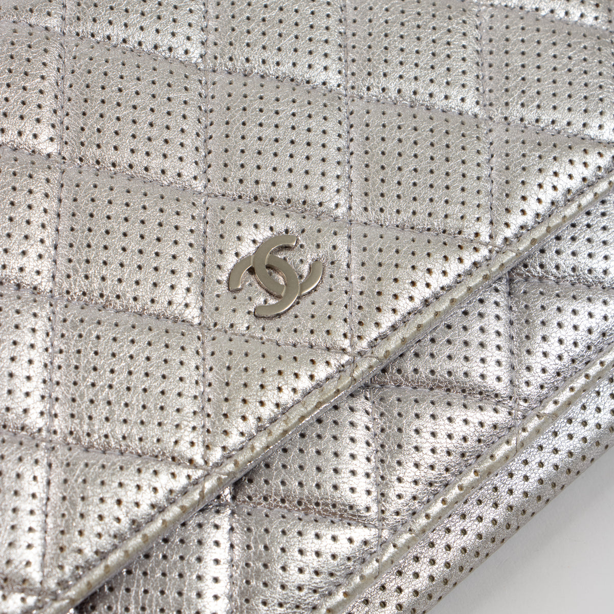 Shop the authentic Chanel Silver Perforated Classic Wallet On Chain Bag