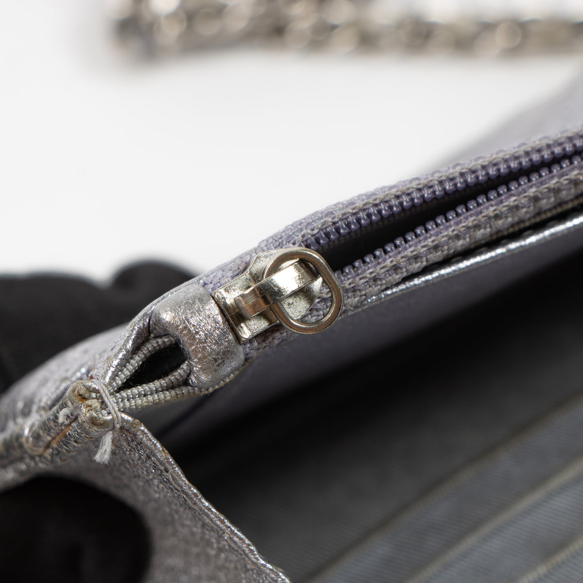 Shop the authentic Chanel Silver Perforated Classic Wallet On Chain Bag
