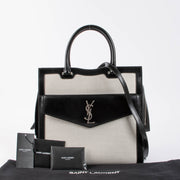 Shop the authentic Saint Laurent Black & White Canvas/Leather Uptown Tote Bag second hand on Labellov.com