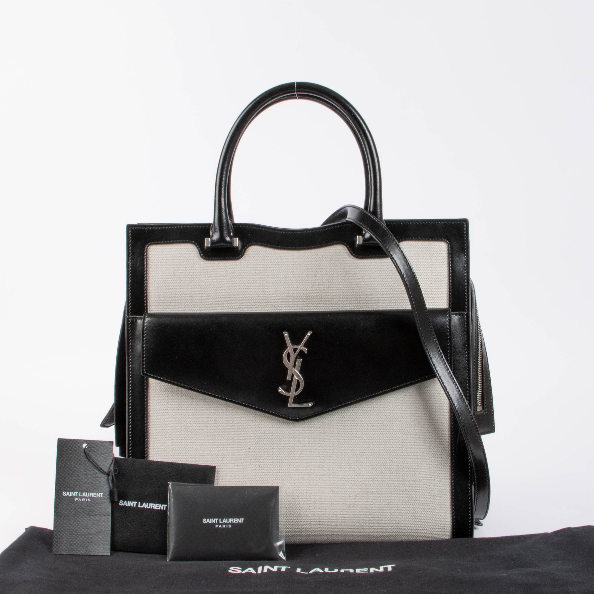 Shop the authentic Saint Laurent Black & White Canvas/Leather Uptown Tote Bag second hand on Labellov.com
