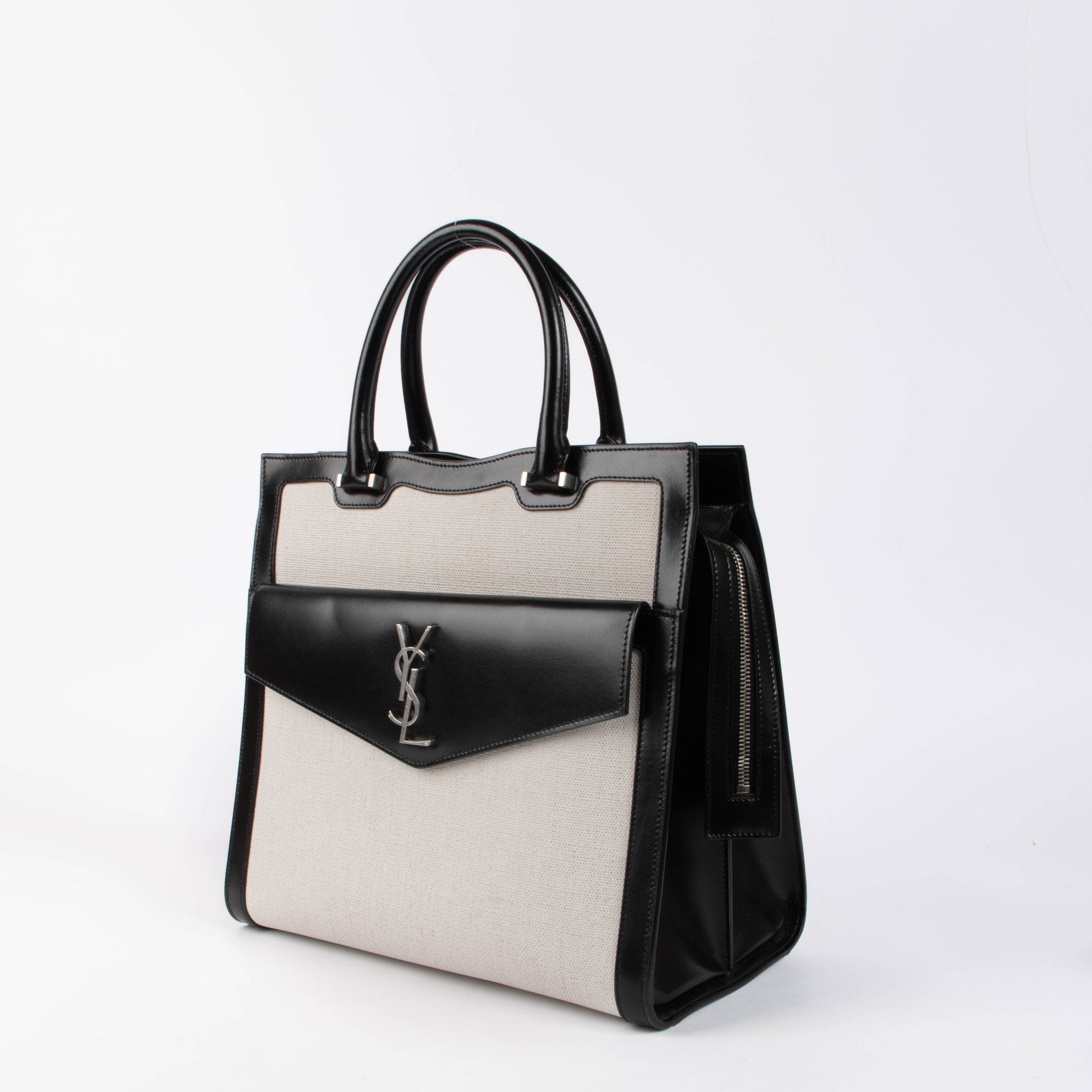 Shop the authentic Saint Laurent Black & White Canvas/Leather Uptown Tote Bag second hand on Labellov.com