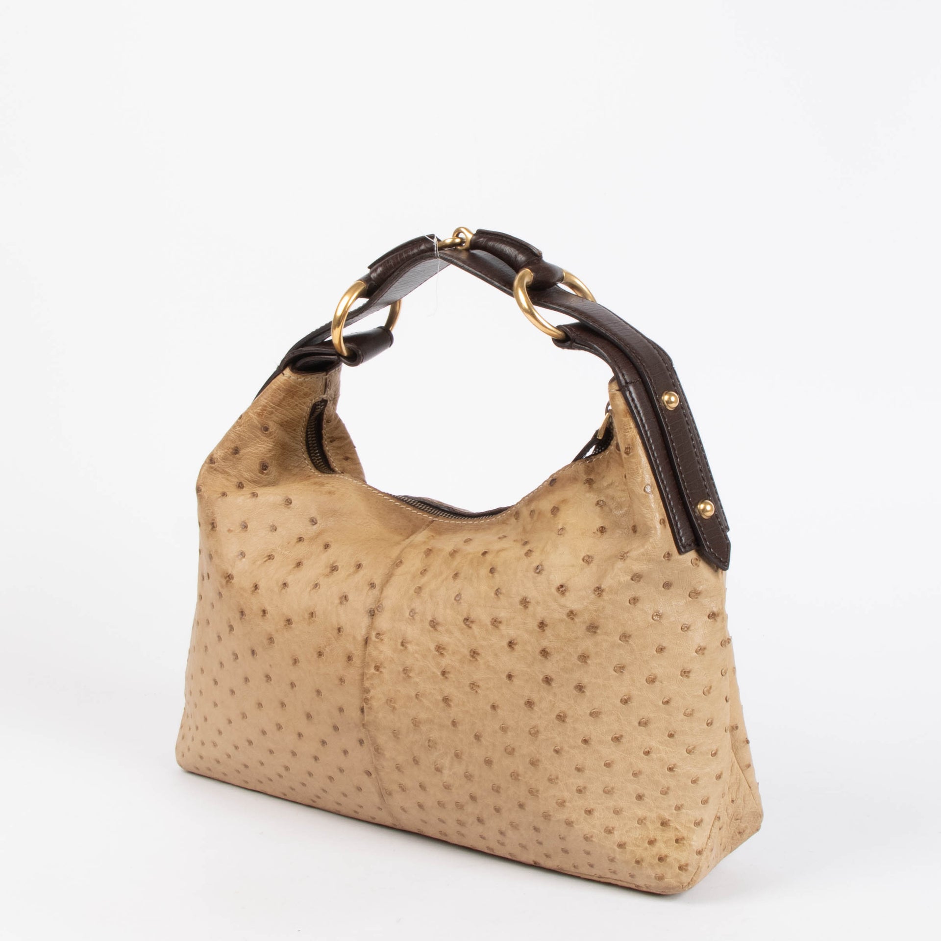 Shop this 100% authentic Gucci Beige Ostrich Small Horsebit Hobo Bag at Labellov.com.