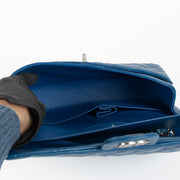 Shop this 100% authentic Chanel Blue Medium Classic Flap Bag at Labellov.com