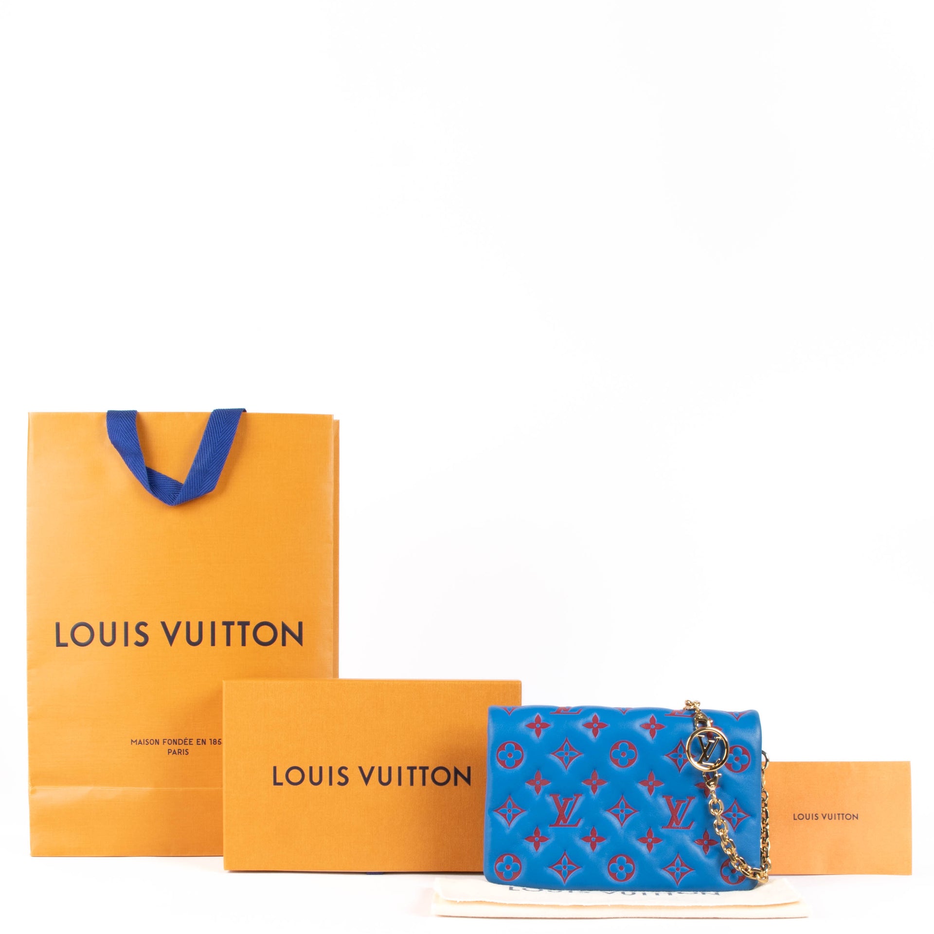 Shop this 100% authentic Louis Vuitton Blue x Red Pochette Coussin Bag at Labellov.com