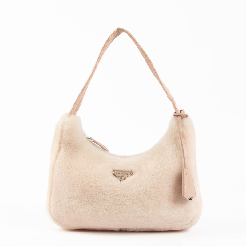 Shop this 100% authentic Prada Pink Re-Edition 2000 Shearling Bag at Labellov.com