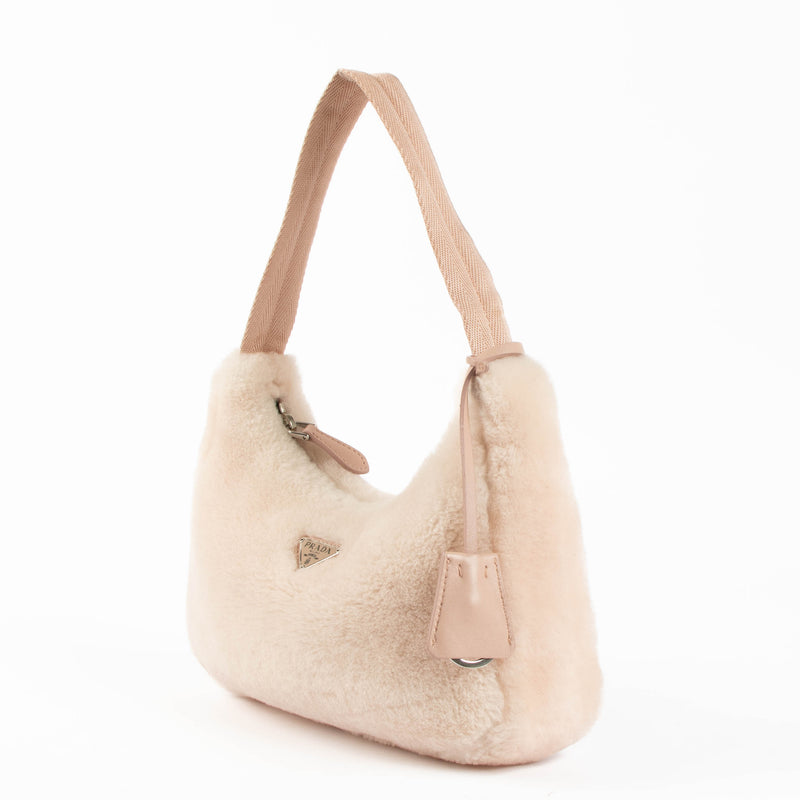 Shop this 100% authentic Prada Pink Re-Edition 2000 Shearling Bag at Labellov.com