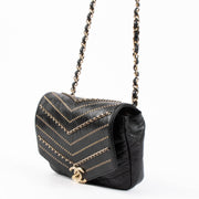 Shop this 100% authentic Chanel Black Chevron Chain Mini Flap Bag at Labellov.com.