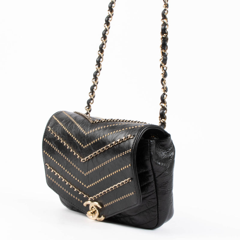 Shop this 100% authentic Chanel Black Chevron Chain Mini Flap Bag at Labellov.com.