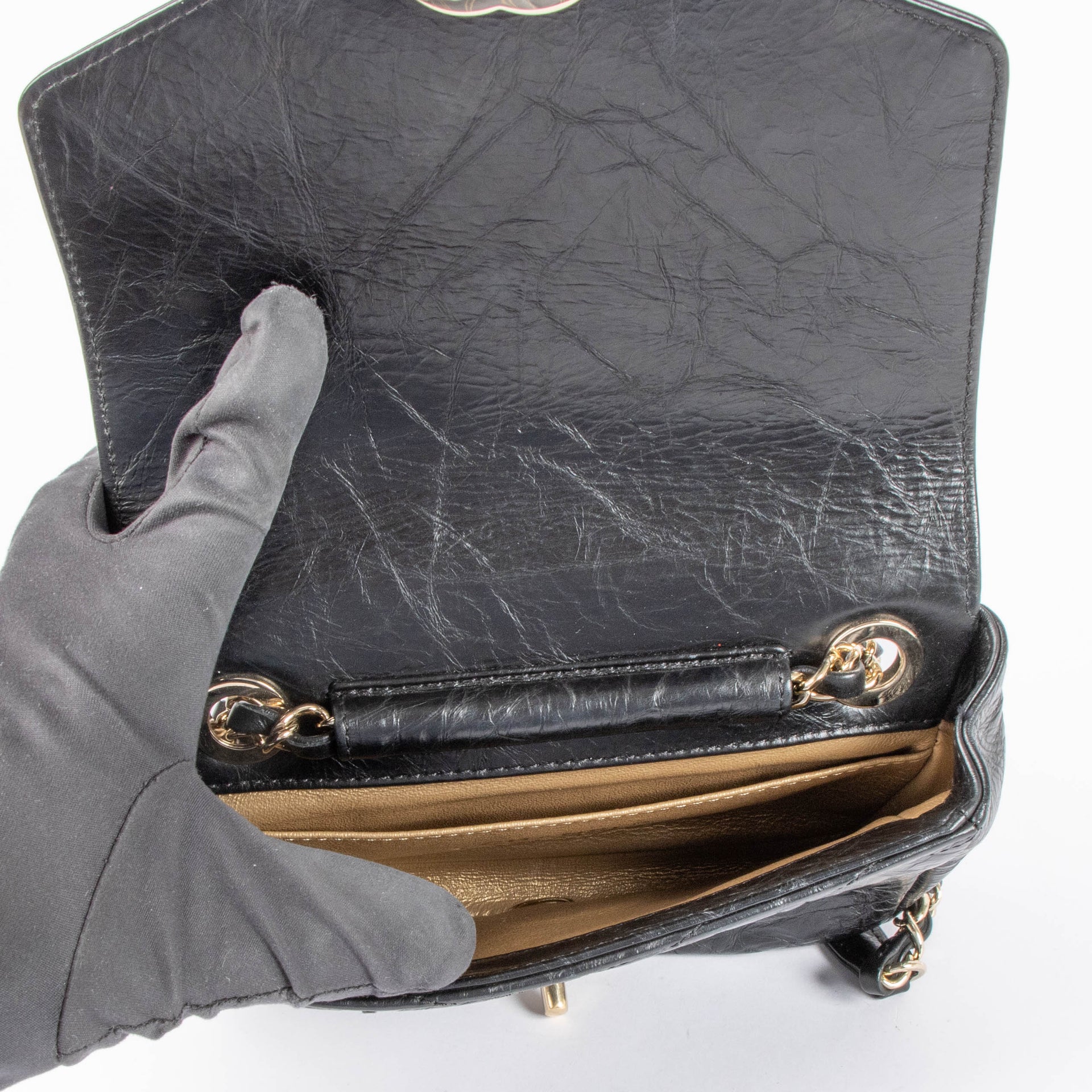 Shop this 100% authentic Chanel Black Chevron Chain Mini Flap Bag at Labellov.com.