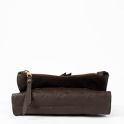 Shop the authentic Louis Vuitton Terre Mongoram Empreinte Petillante Clutch second hand on Labellov.com