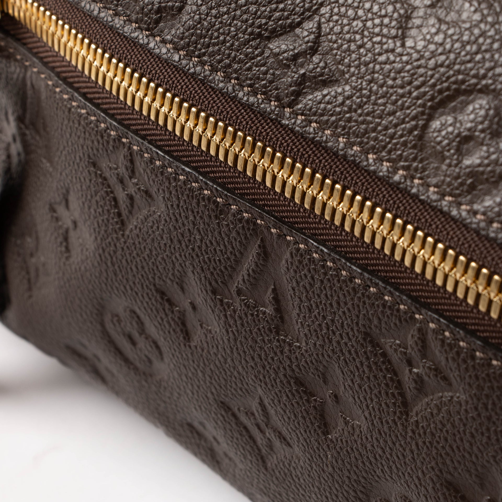 Shop the authentic Louis Vuitton Terre Mongoram Empreinte Petillante Clutch second hand on Labellov.com