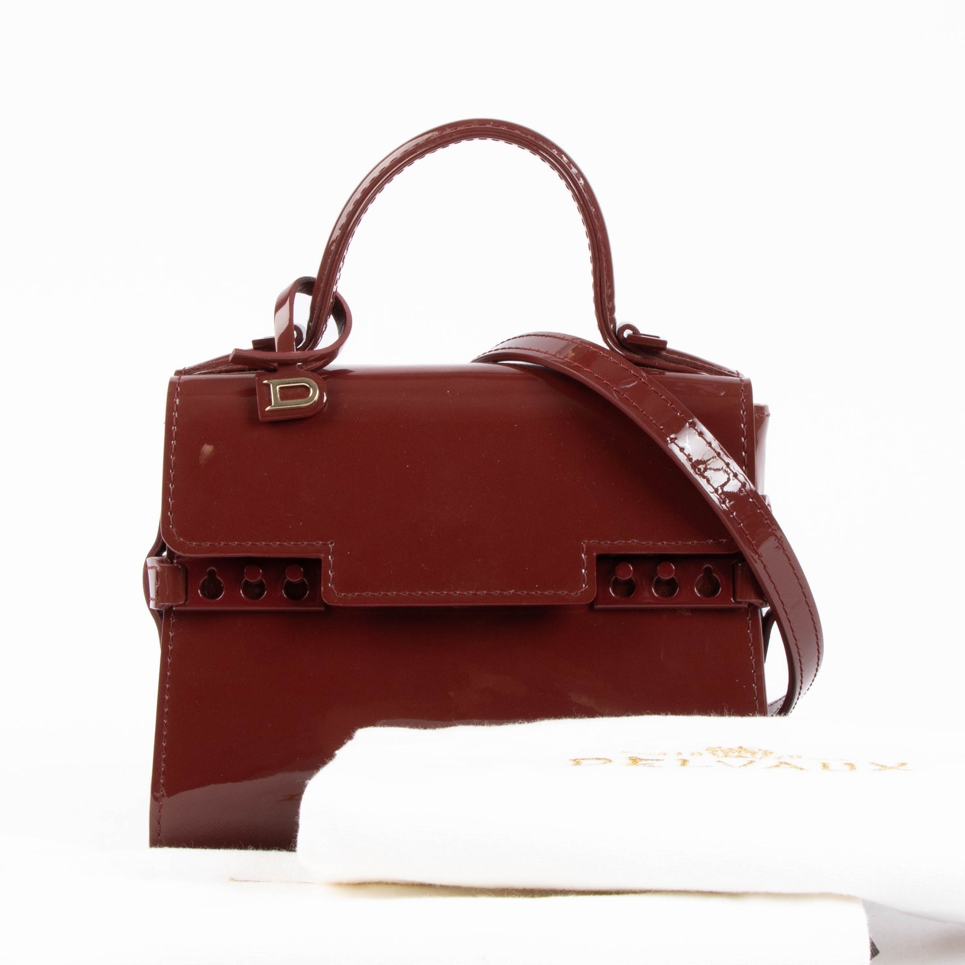 Shop the authentic Delvaux Rouge de Pourpre Vernis Tempête Micro Bag second hand on Labellov.com