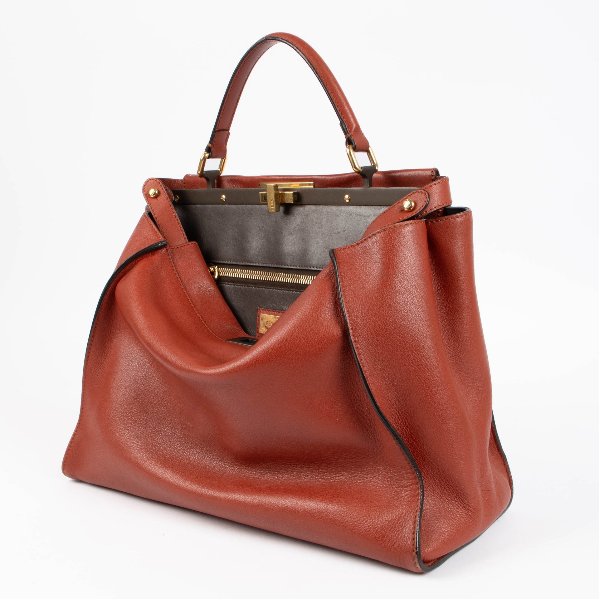 Shop the authentic Fendi Rust Leather Large Peekaboo Handbag second hand on Labellov.com