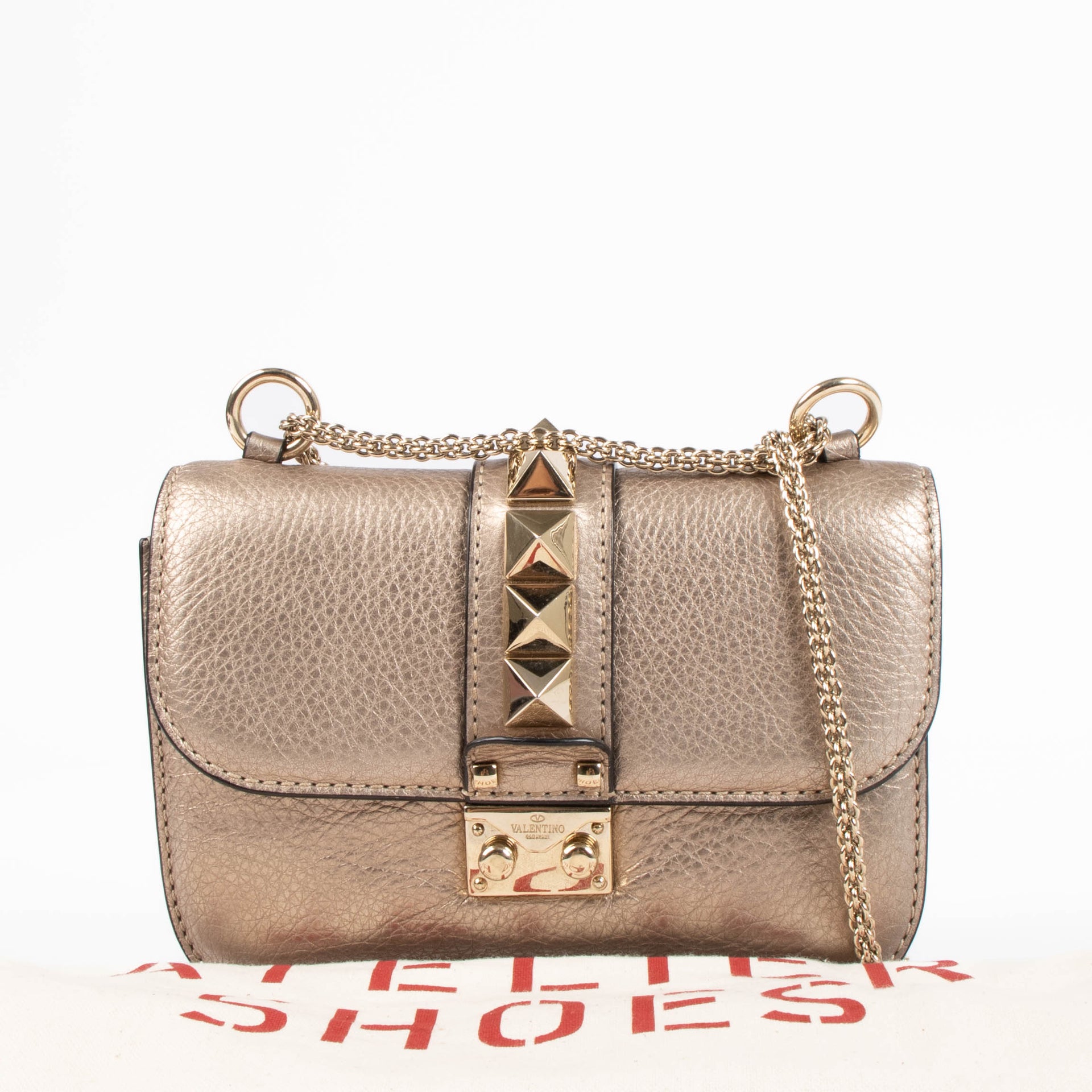 Shop this authentic Valentino Garavani Gold Small Glam Lock Bag pre-loved on Labellov.com