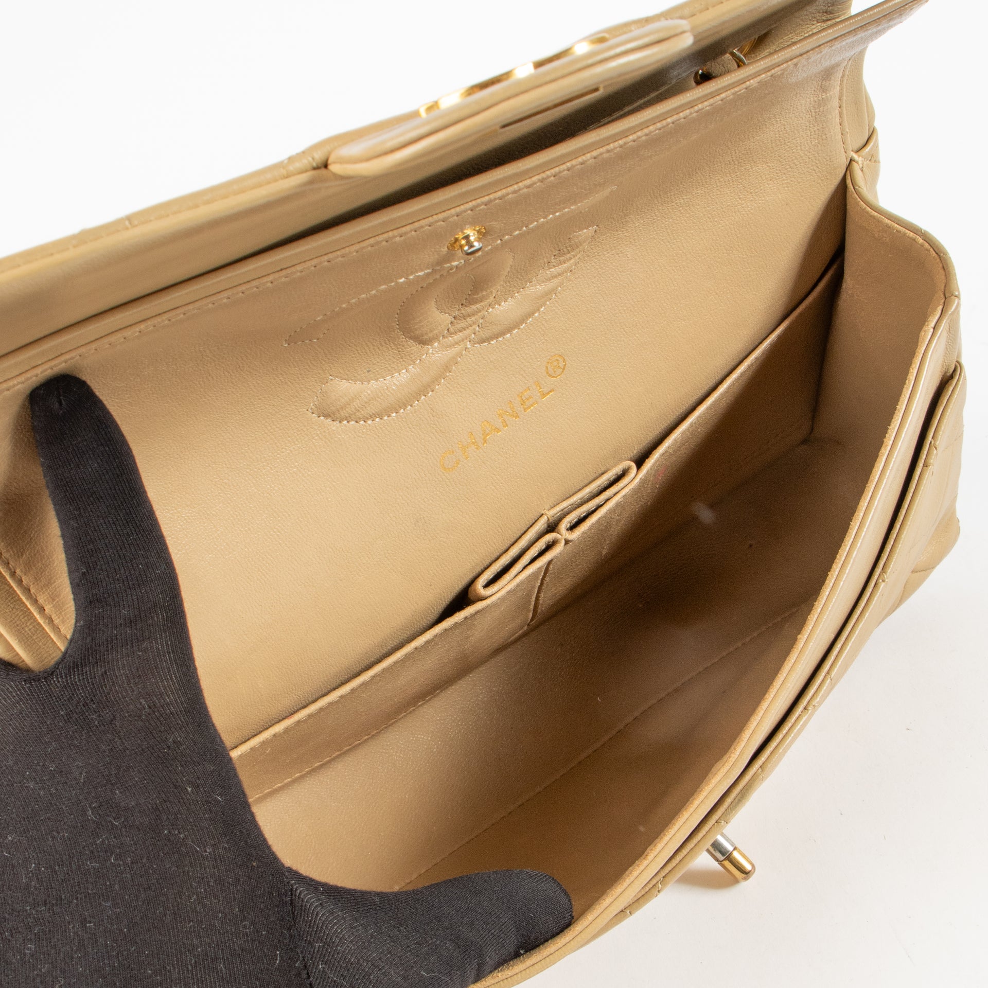 Shop this authentic Chanel Vintage Beige Lambskin Medium Classic bag pre-loved on Labellov.com