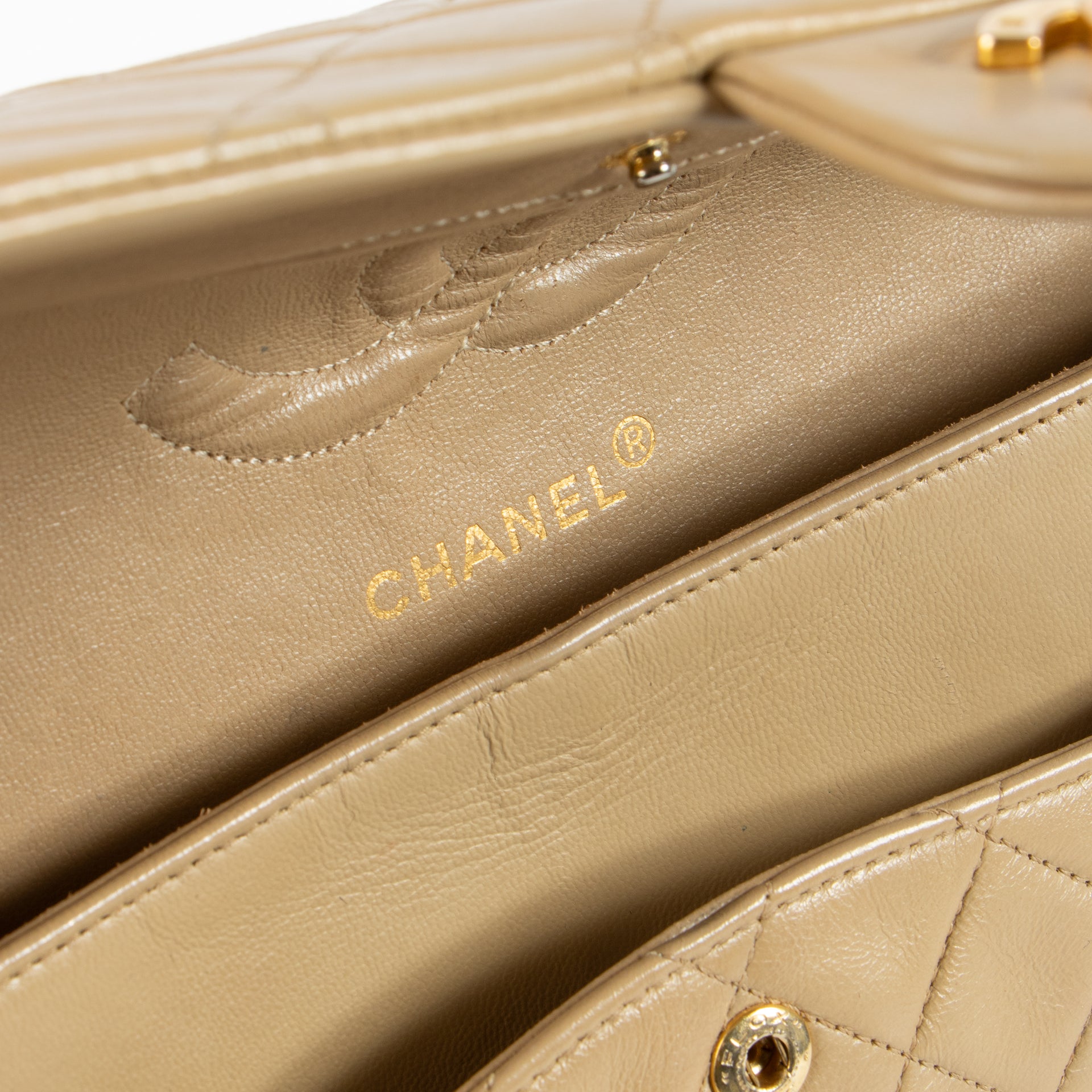 Shop this authentic Chanel Vintage Beige Lambskin Medium Classic bag pre-loved on Labellov.com