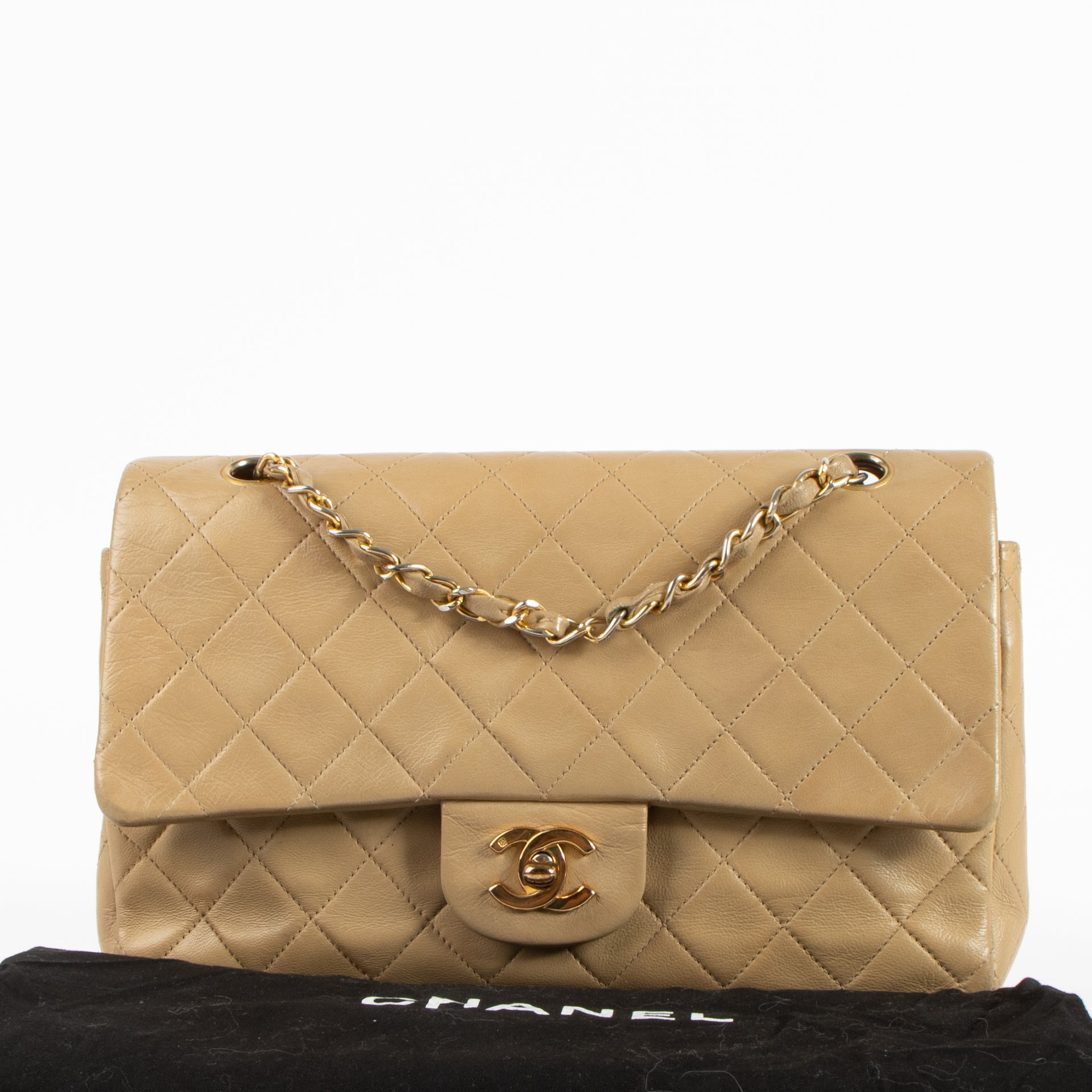 Shop this authentic Chanel Vintage Beige Lambskin Medium Classic bag pre-loved on Labellov.com