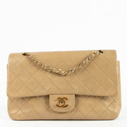 Shop this authentic Chanel Vintage Beige Lambskin Medium Classic bag pre-loved on Labellov.com