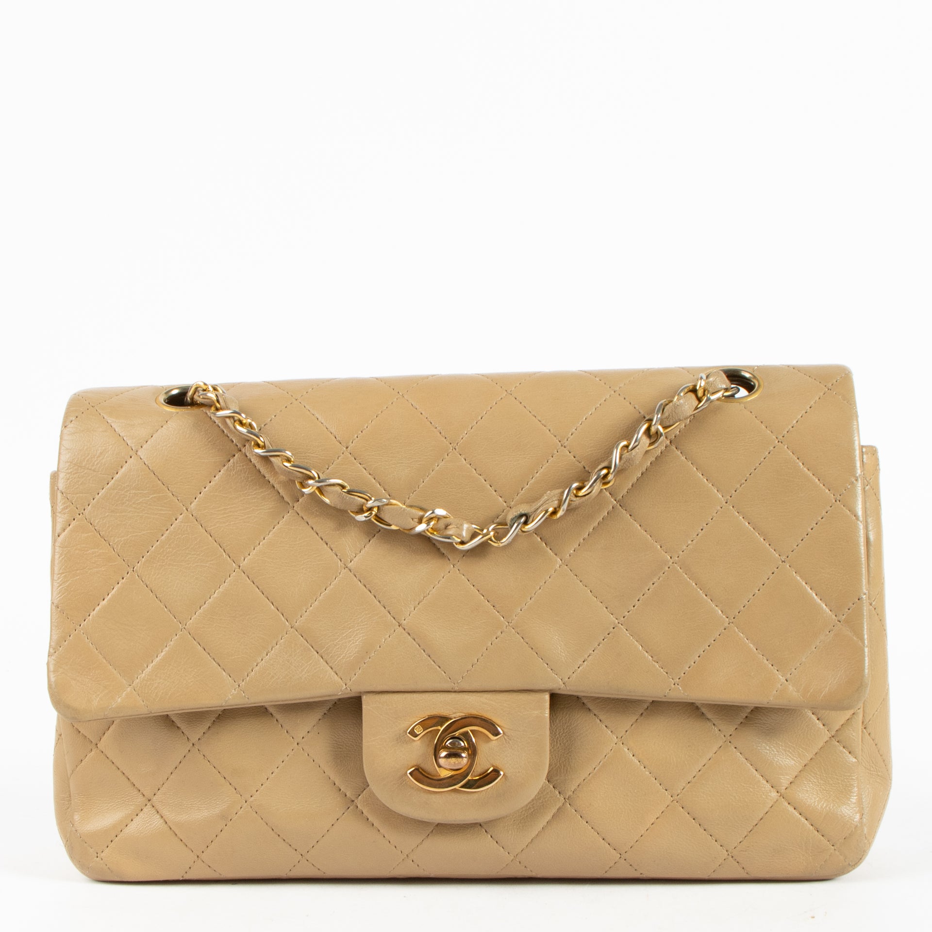 Shop this authentic Chanel Vintage Beige Lambskin Medium Classic bag pre-loved on Labellov.com