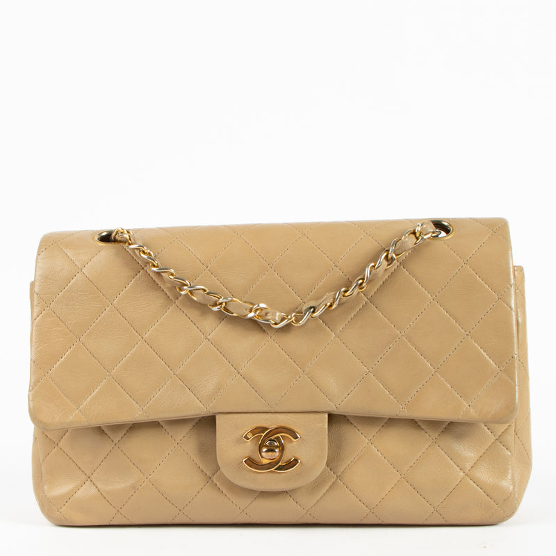 Shop this authentic Chanel Vintage Beige Lambskin Medium Classic bag pre-loved on Labellov.com