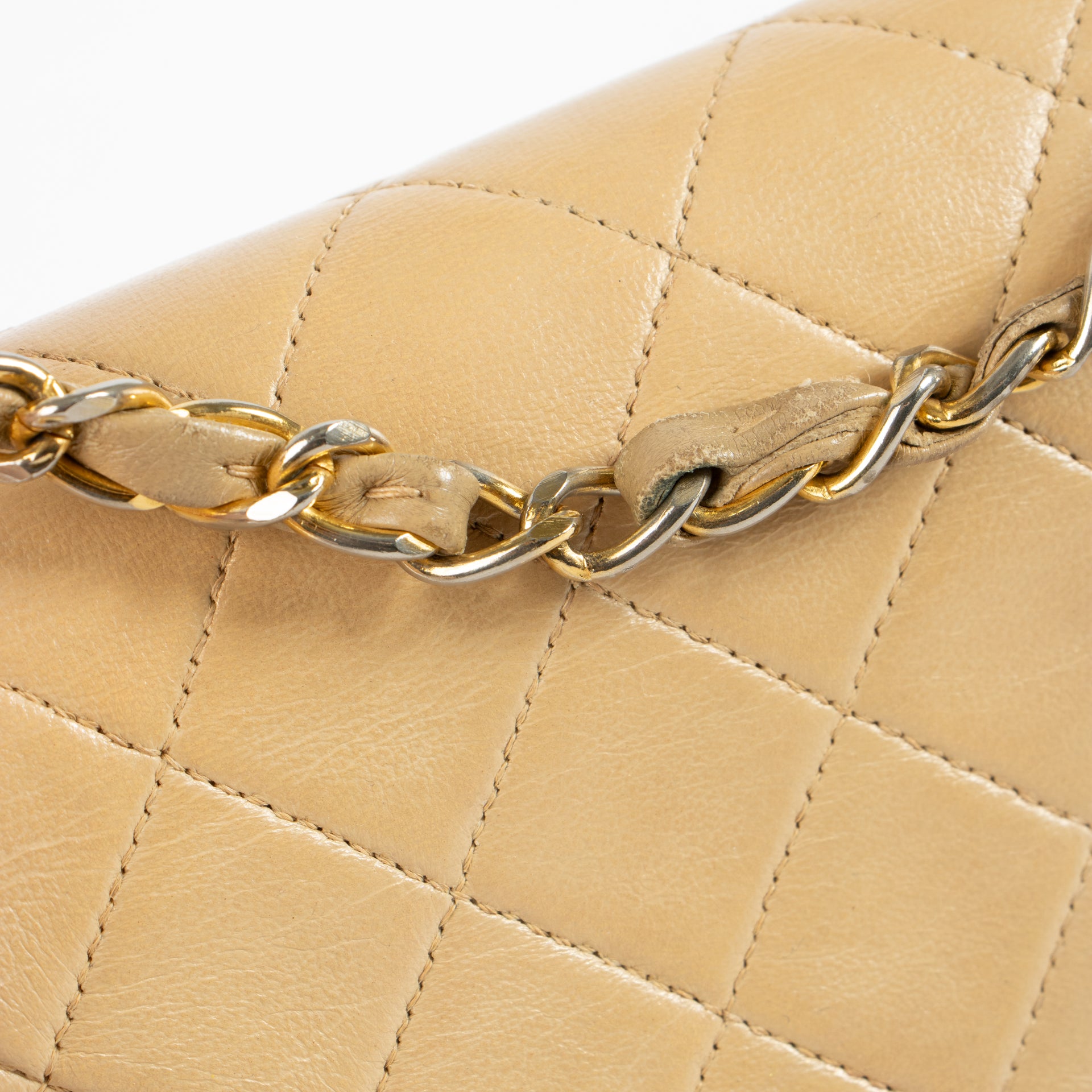 Shop this authentic Chanel Vintage Beige Lambskin Medium Classic bag pre-loved on Labellov.com