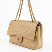 Shop this authentic Chanel Vintage Beige Lambskin Medium Classic bag pre-loved on Labellov.com