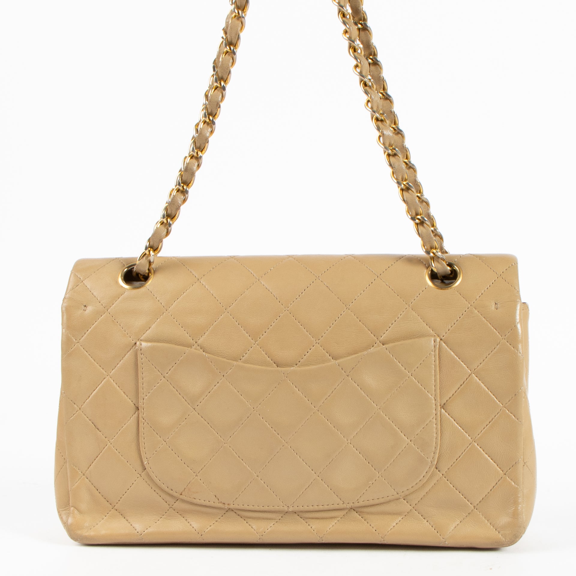 Shop this authentic Chanel Vintage Beige Lambskin Medium Classic bag pre-loved on Labellov.com