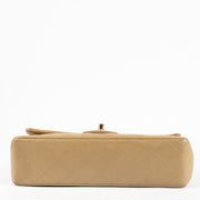 Shop this authentic Chanel Vintage Beige Lambskin Medium Classic bag pre-loved on Labellov.com
