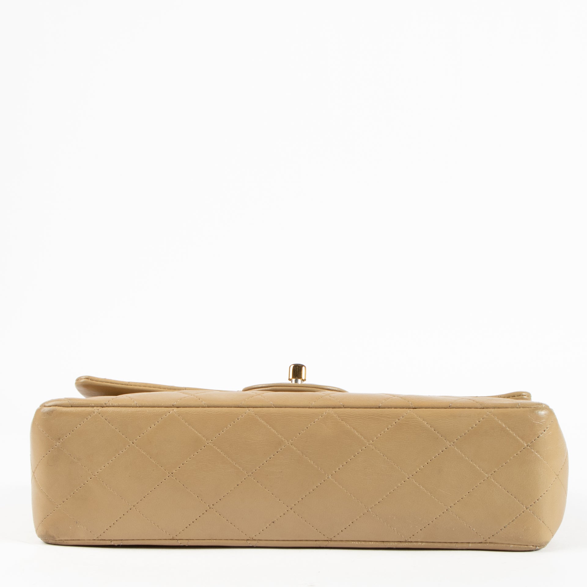 Shop this authentic Chanel Vintage Beige Lambskin Medium Classic bag pre-loved on Labellov.com