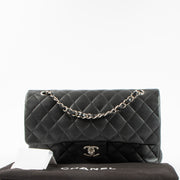 Shop authentic Chanel Black Lambskin Medium Classic 11.12 Handbag on Labellov.com.