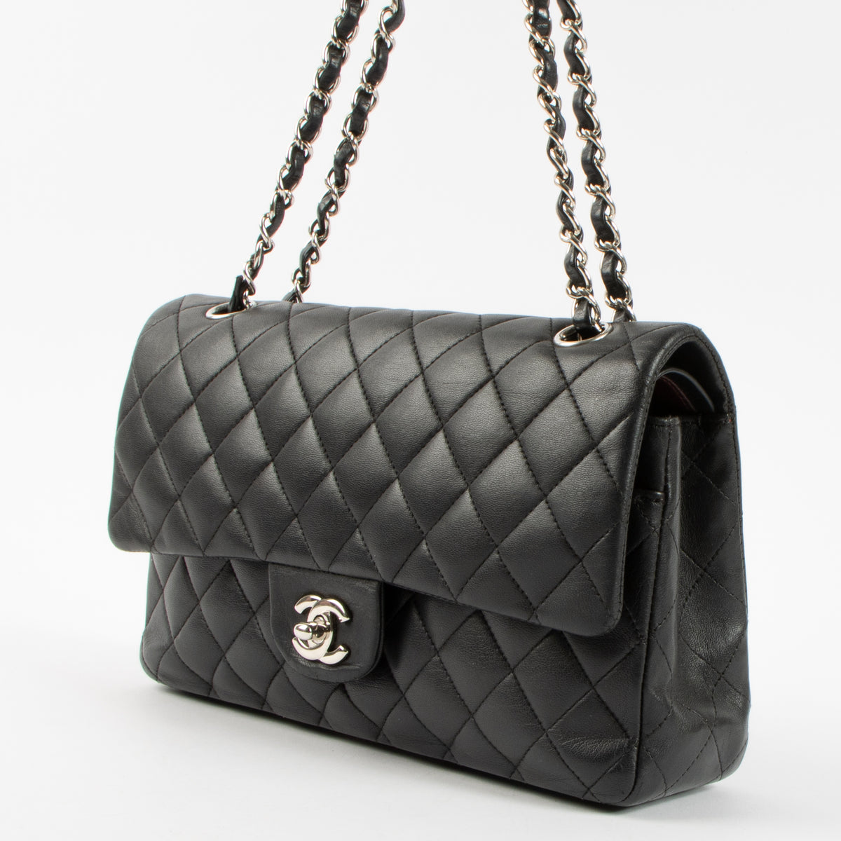 Shop authentic Chanel Black Lambskin Medium Classic 11.12 Handbag on Labellov.com.