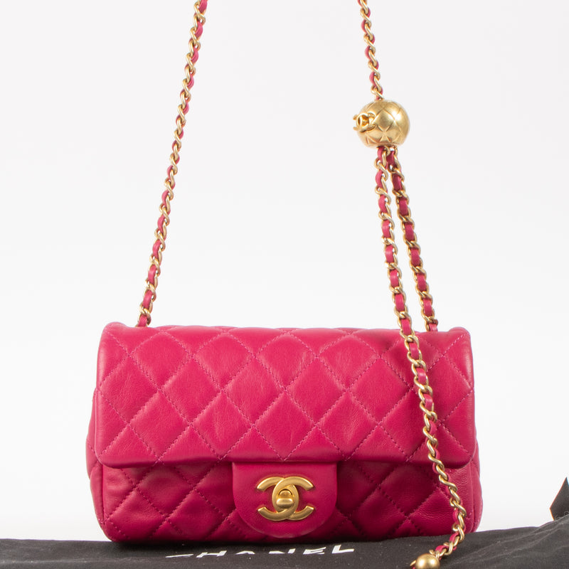 Shop this authentic luxury Chanel Fuchsia Lambskin Pearl Crush Mini Flap Bag pre-loved by Labellov.com