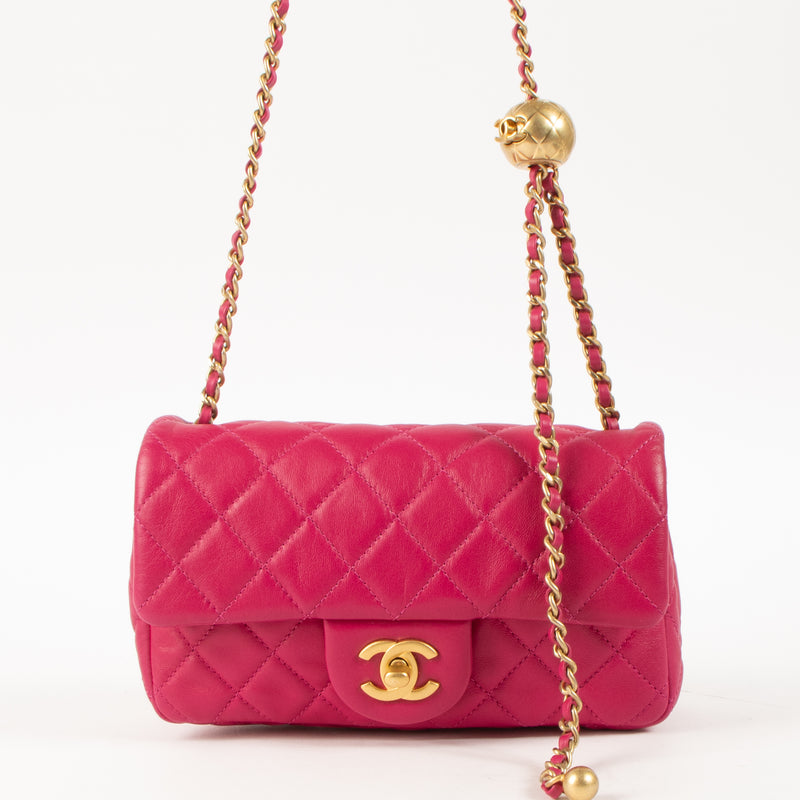 Shop this authentic luxury Chanel Fuchsia Lambskin Pearl Crush Mini Flap Bag pre-loved by Labellov.com