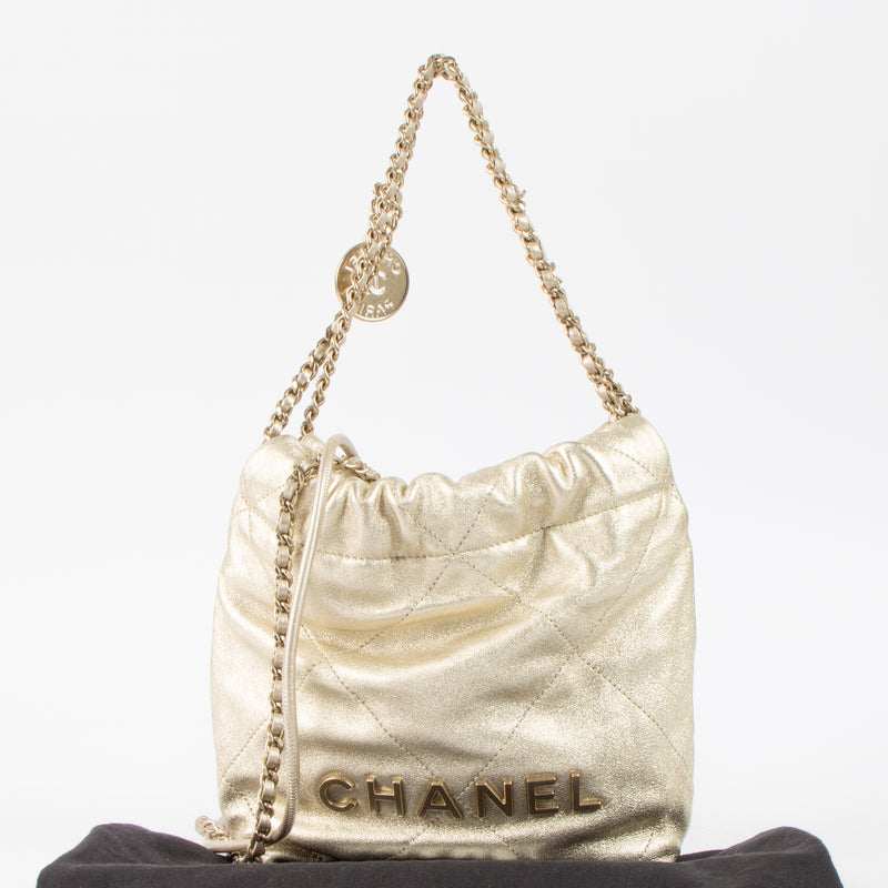 Shop this authentic Chanel Gold Lambskin Chanel 22 Mini Bag pre-loved on Labellov.