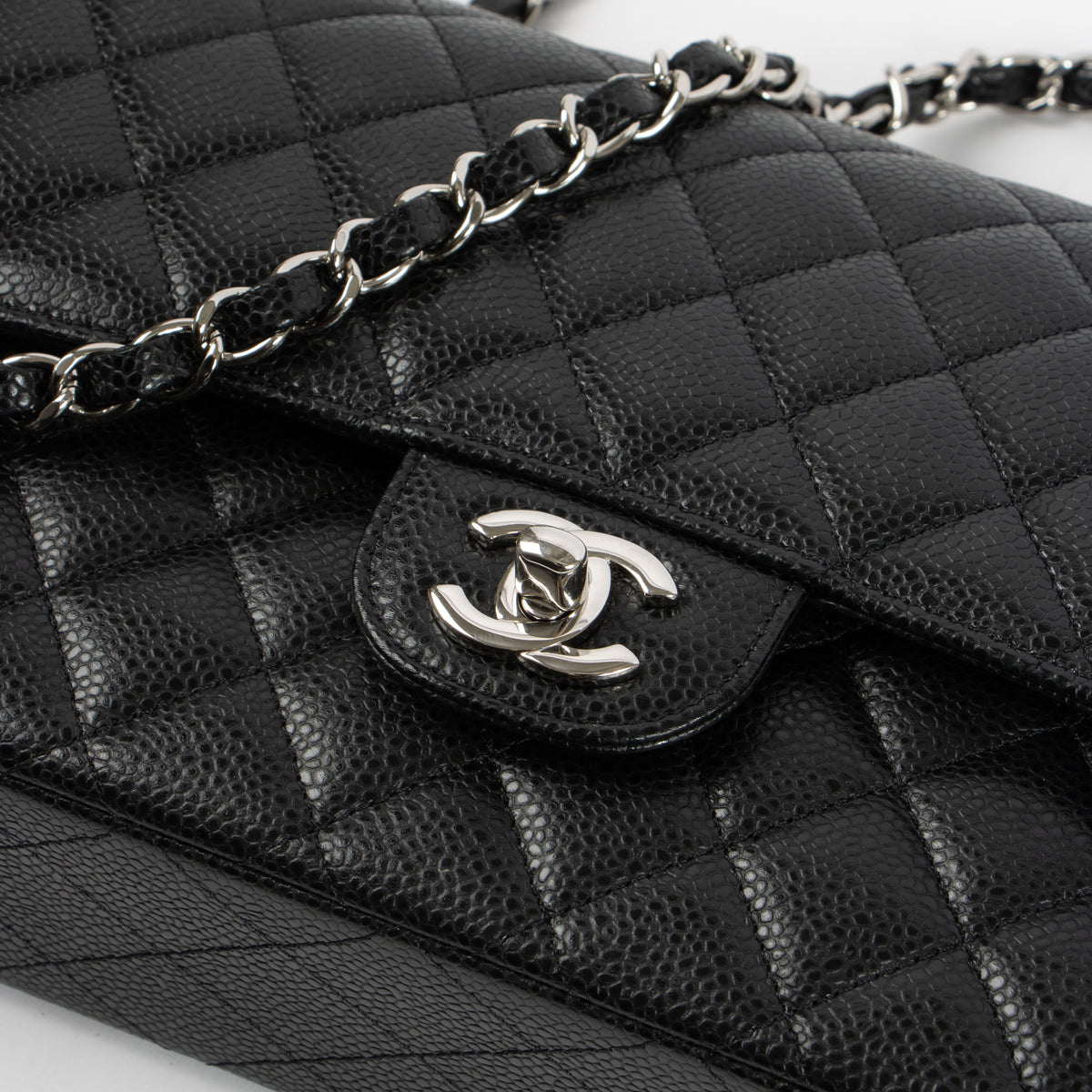 Shop the authentic Chanel Black Caviar Medium Classic 11.12 Handbag on Labellov.com.