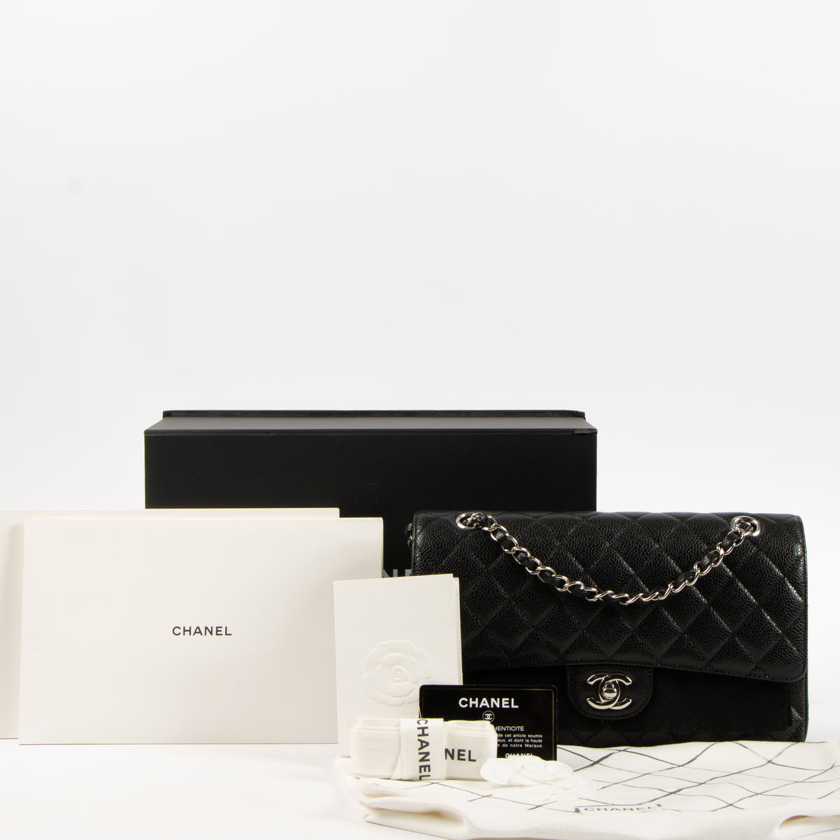 Shop the authentic Chanel Black Caviar Medium Classic 11.12 Handbag on Labellov.com.
